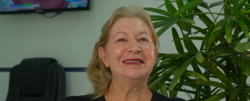 Sorriso transformado de paciente OdontoMax 3